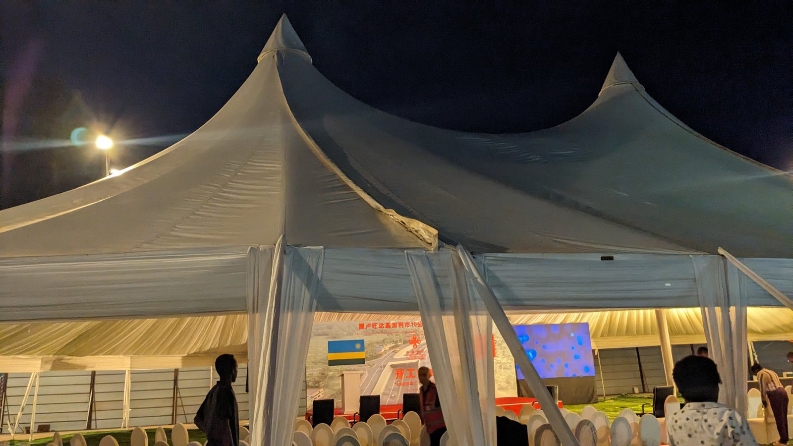 Marquee tent exterior at night during corporate event